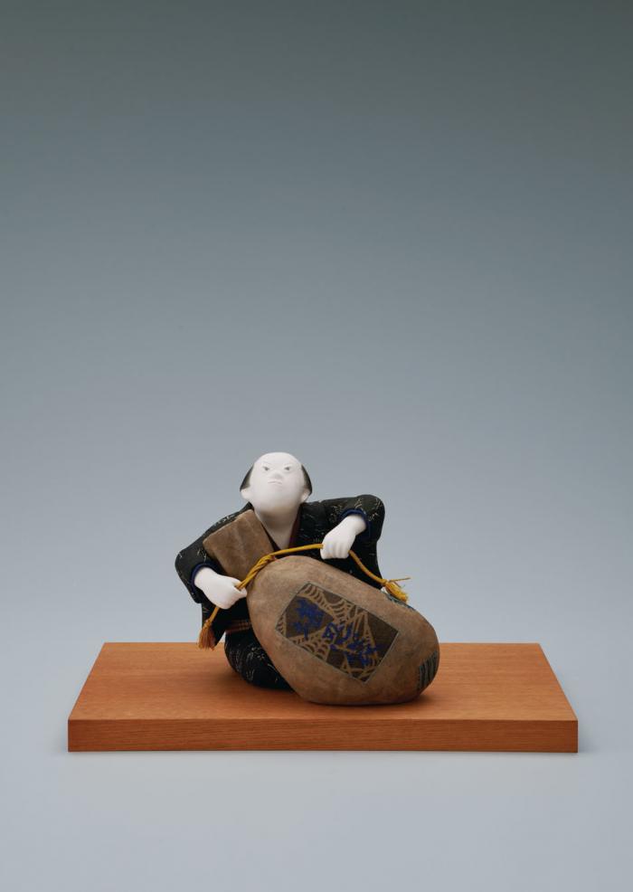 木芯桐塑木目込「継ぎだらけの堪忍袋」